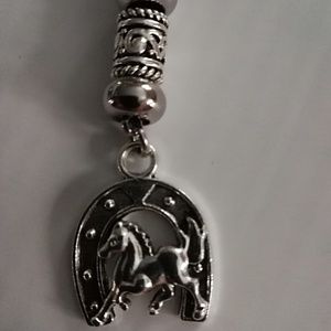 Women's leather necklace with horseshoe charm